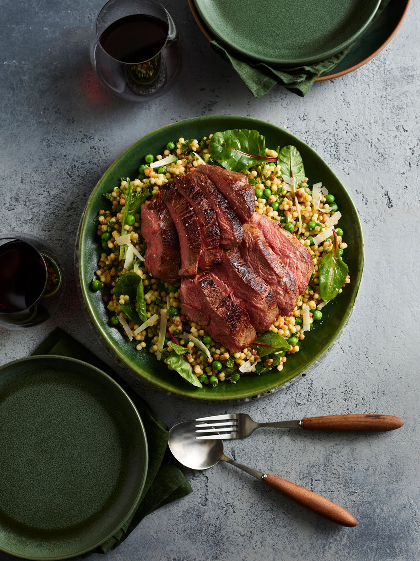 Roasted lamb rump with fregola, pea, mint and pecorino salad