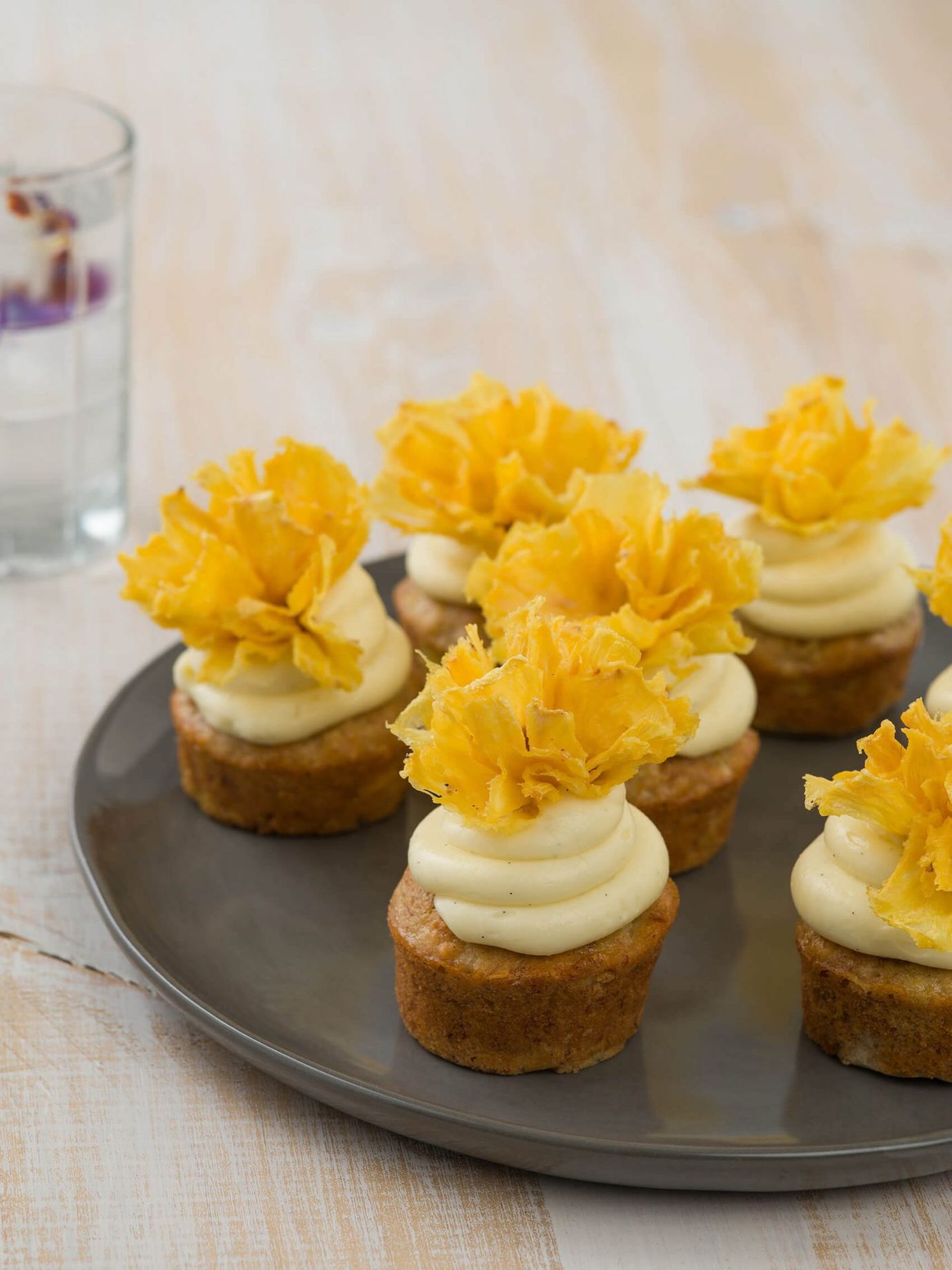 Pineapple cupcakes with dehydrated pineapple flowers
