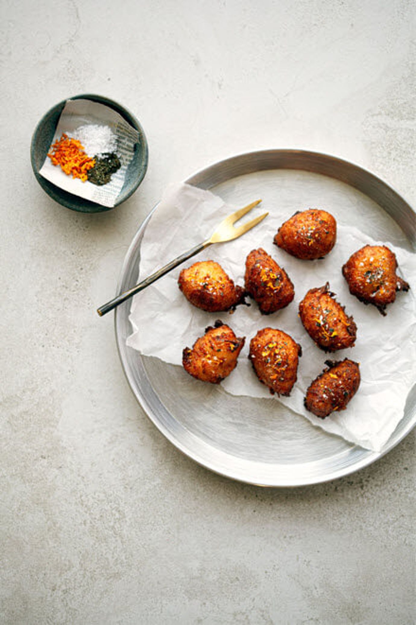 Manchego fritters with kawakawa and orange salt