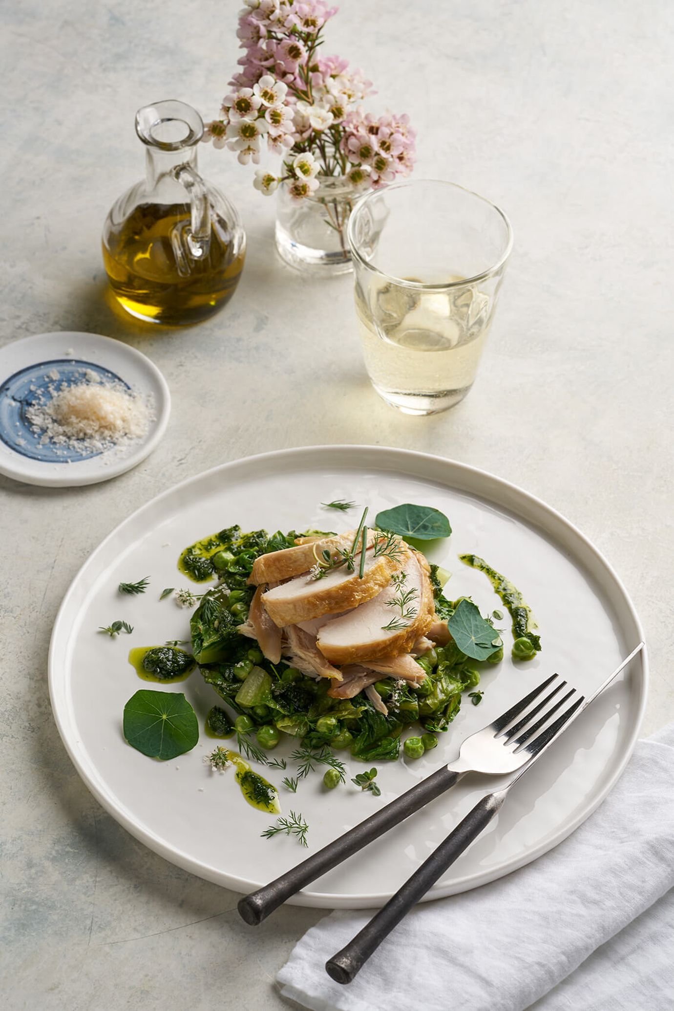 Roast chicken breast, confit leg, lettuce, peas, herbs