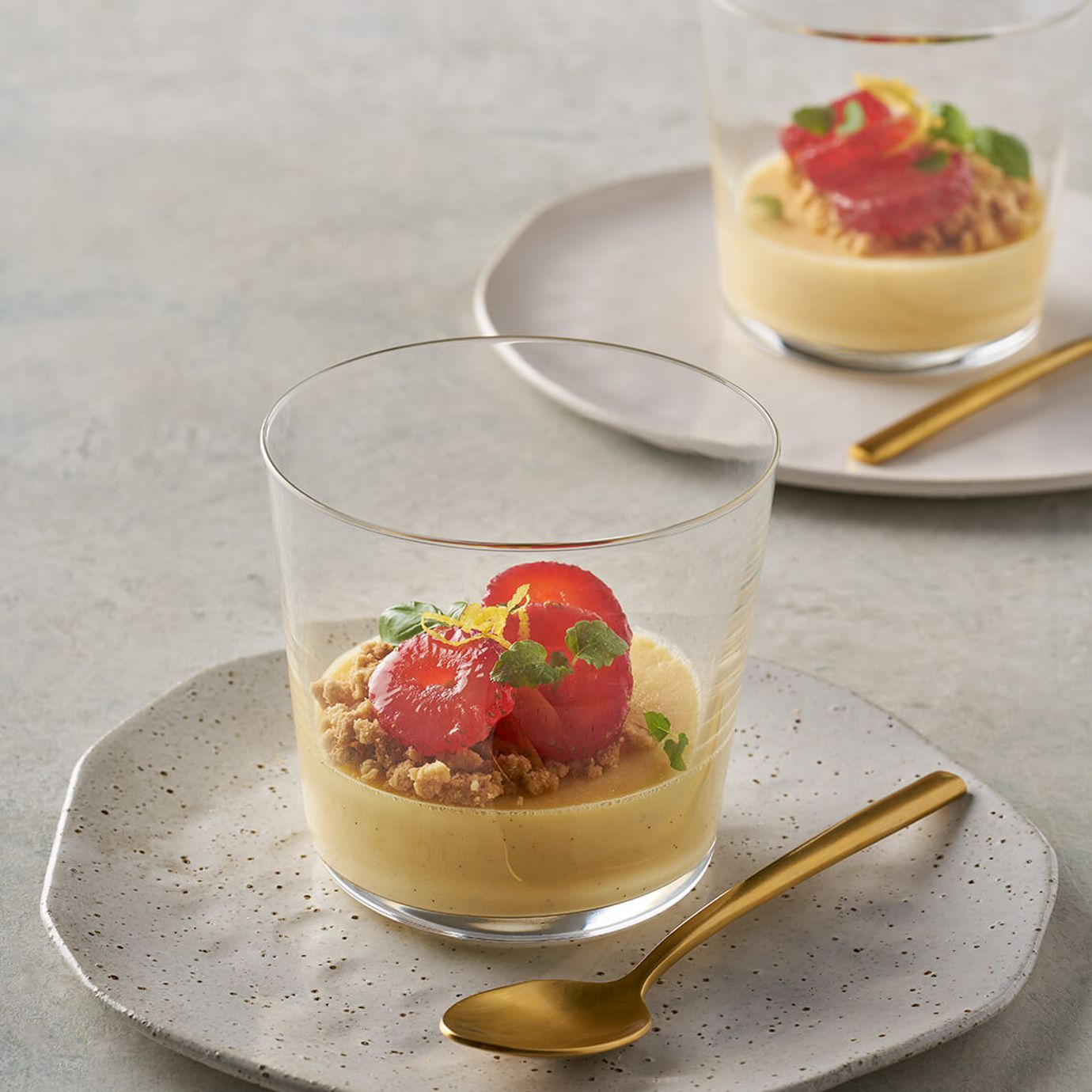 Ricotta cheesecake, compressed strawberries and biscuit crumbs