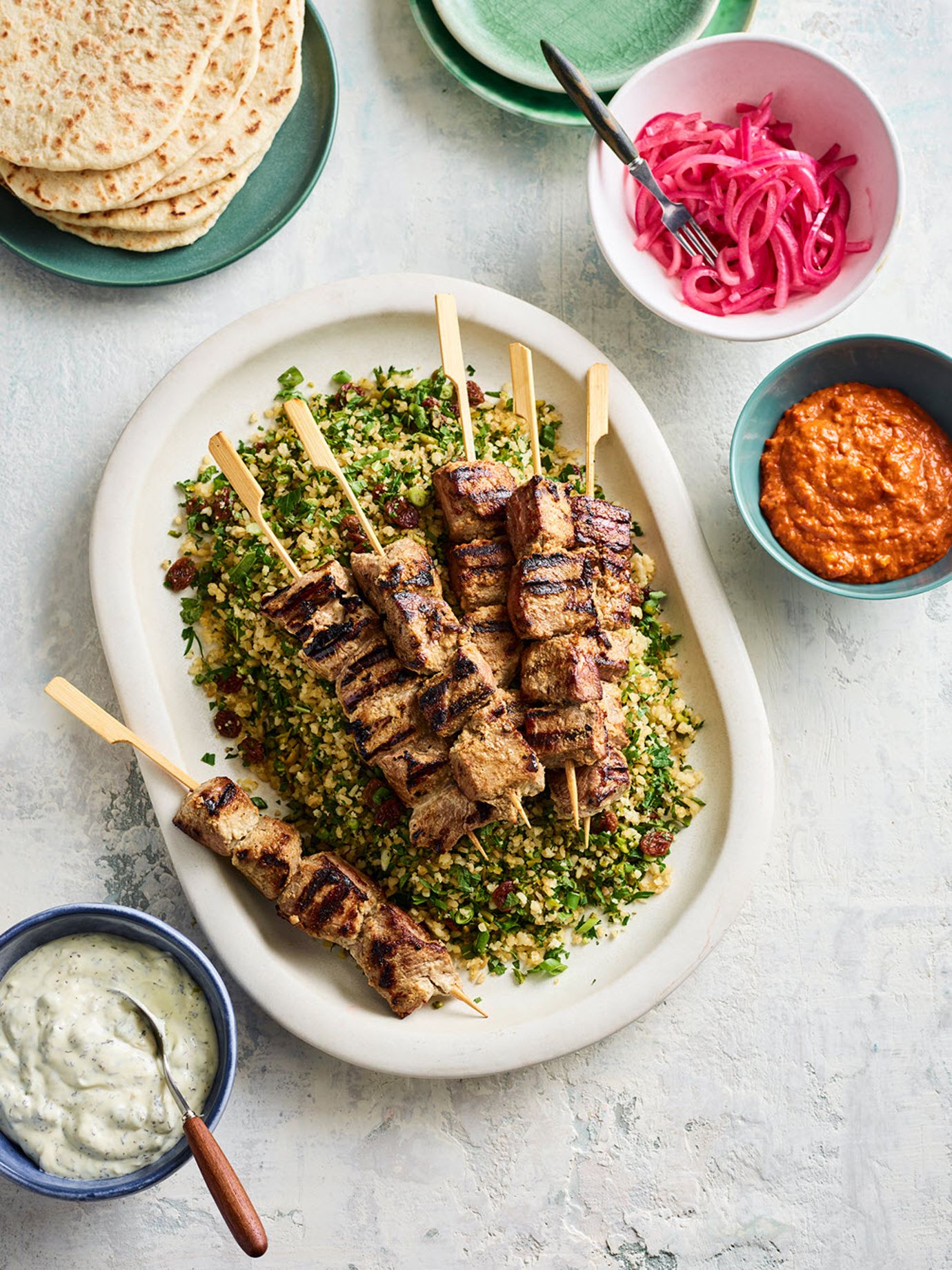 Lamb kebabs with bulgur salad and sumac pickled onions