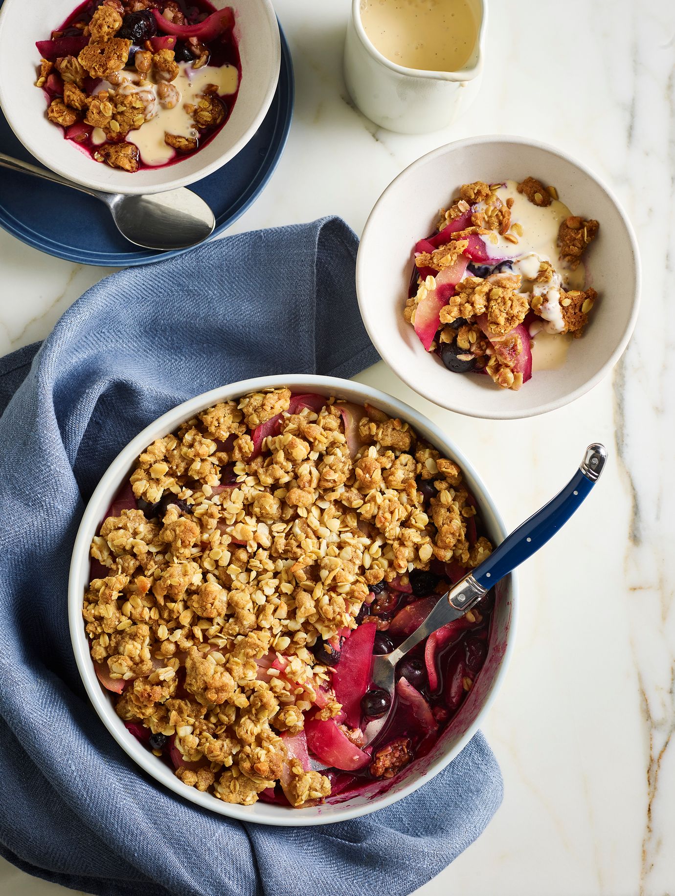 Apple and blueberry crumble with crème anglaise
