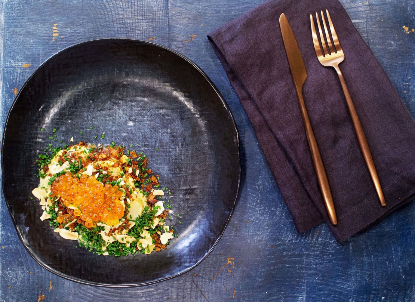 Whole baked celeriac, caviar and egg yolk sauce