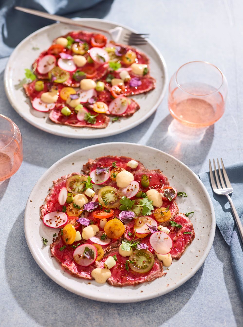 Beef carpaccio with spring onion, caramelised mustard seeds and kimizu