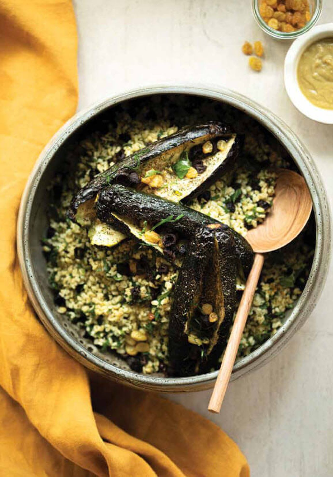 Blackened zucchini with bulgur and olive salad