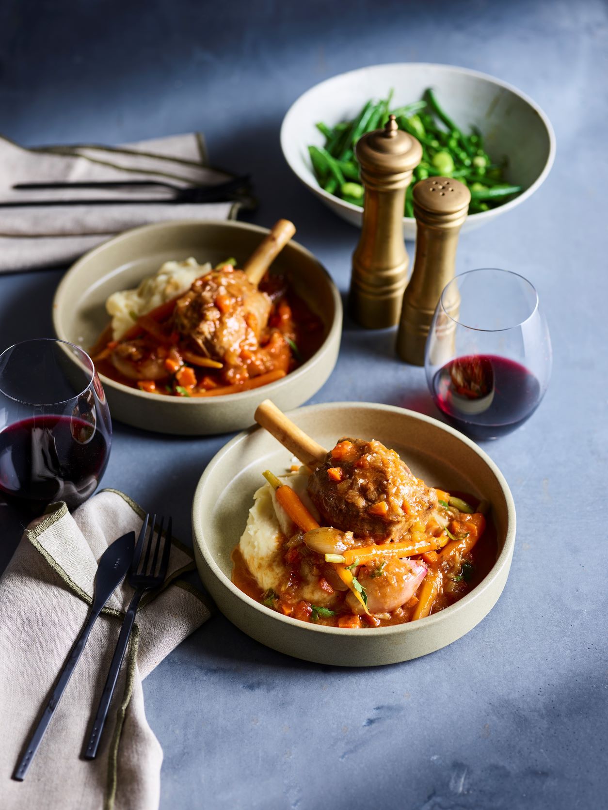 Lamb shanks navarin with mashed potatoes, peas and beans