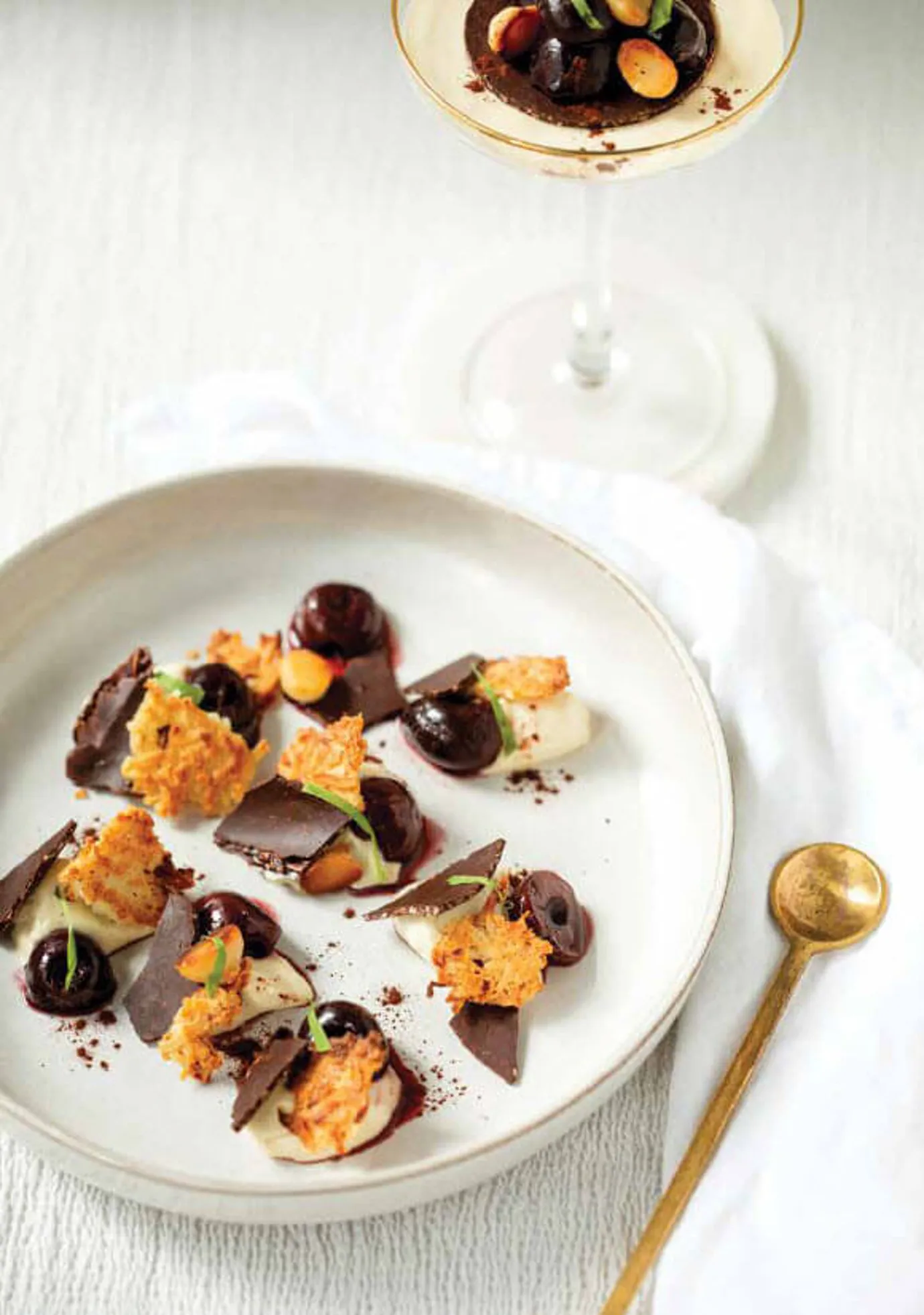 Coconut panna cotta with cherries and macadamias