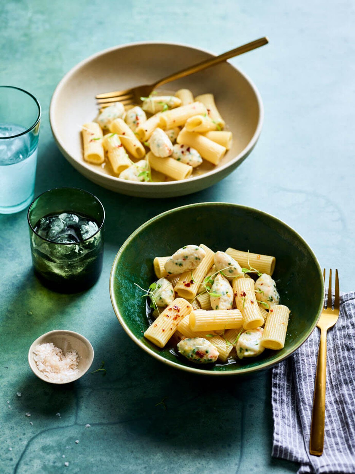 Crab meat balls poached in white wine and garlic sauce with rigatoni