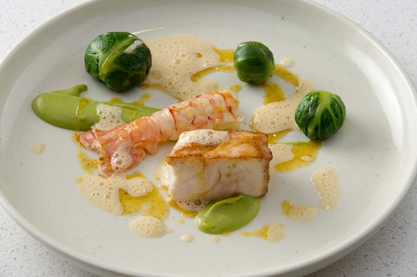 Hapuku, buttered scampi, vanilla, Brussels sprouts, choux farcis