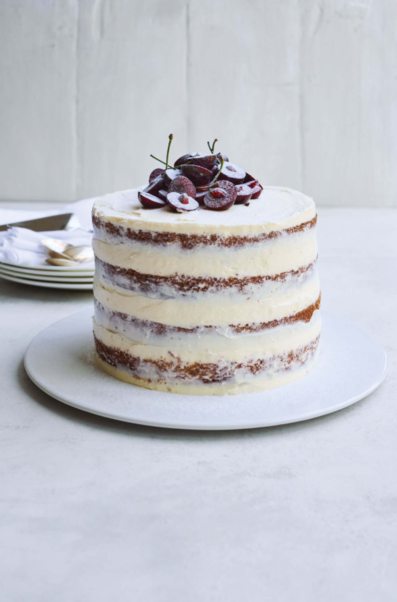 Pistachio cake with cherry compote and cream cheese icing
