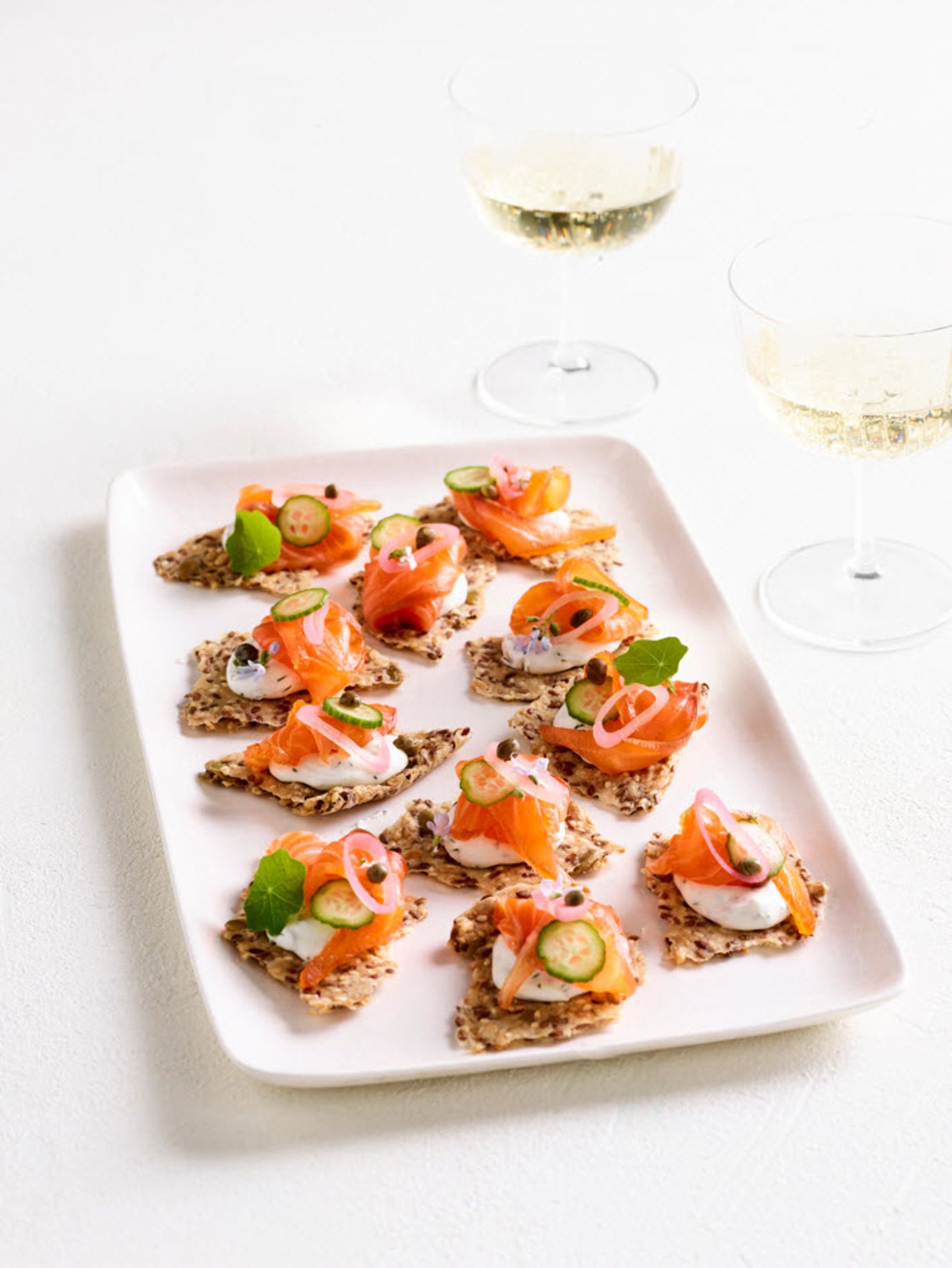 Seeded crackers with cured salmon and goat's cheese