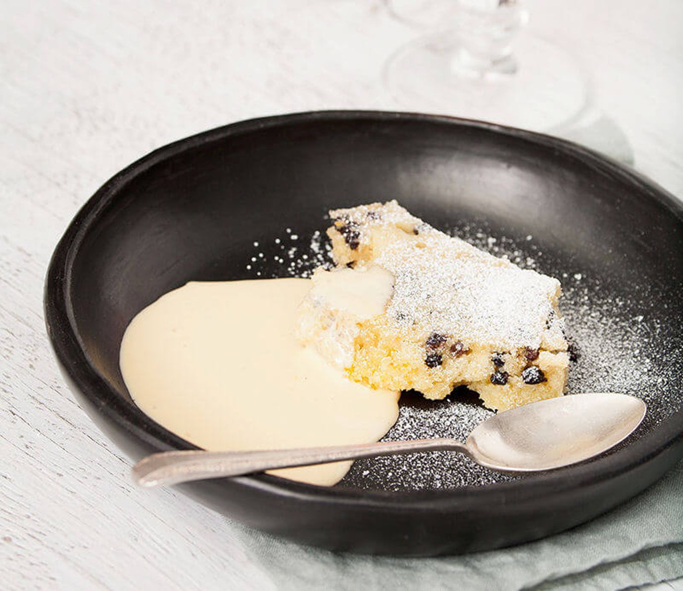 Spotted dick pudding with crème anglaise