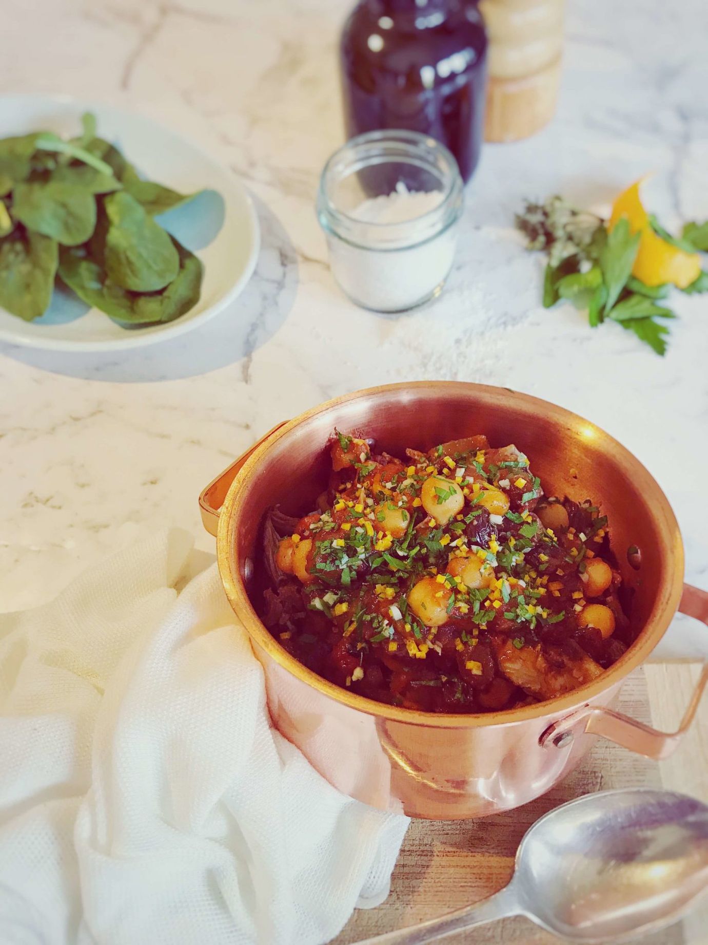 Lamb tagine with harissa, chickpeas, raisins and gremolata