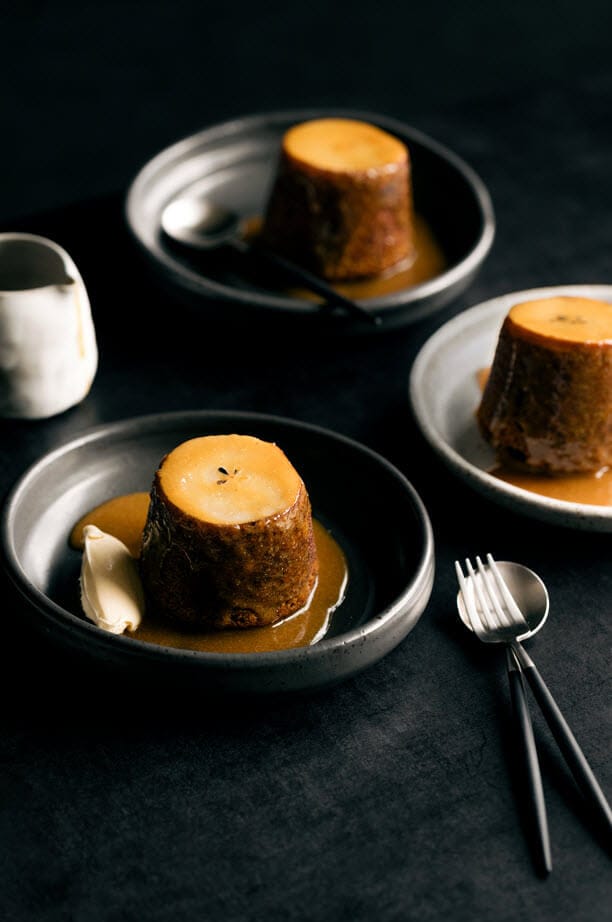 Sticky date and spiced pear puddings with cognac spiked caramel sauce