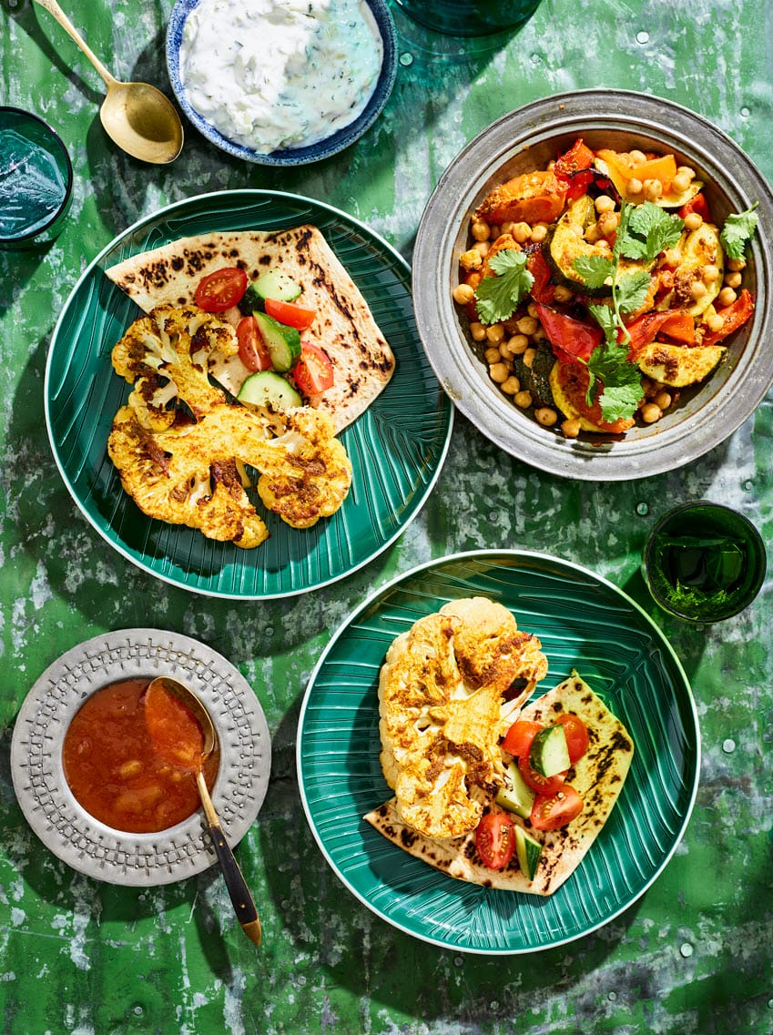 Cauliflower steaks with korma vegetables and raita