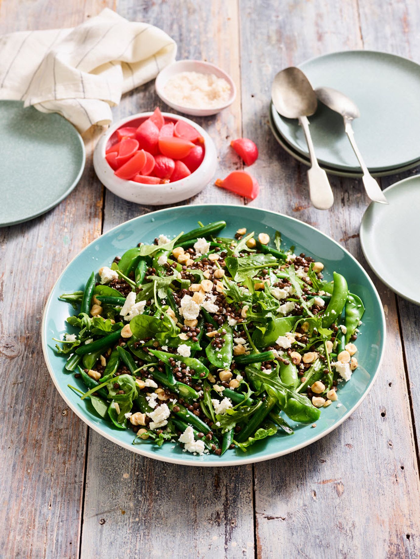Spring bean and lentil salad with hazelnuts, pickled radish and salted ricotta