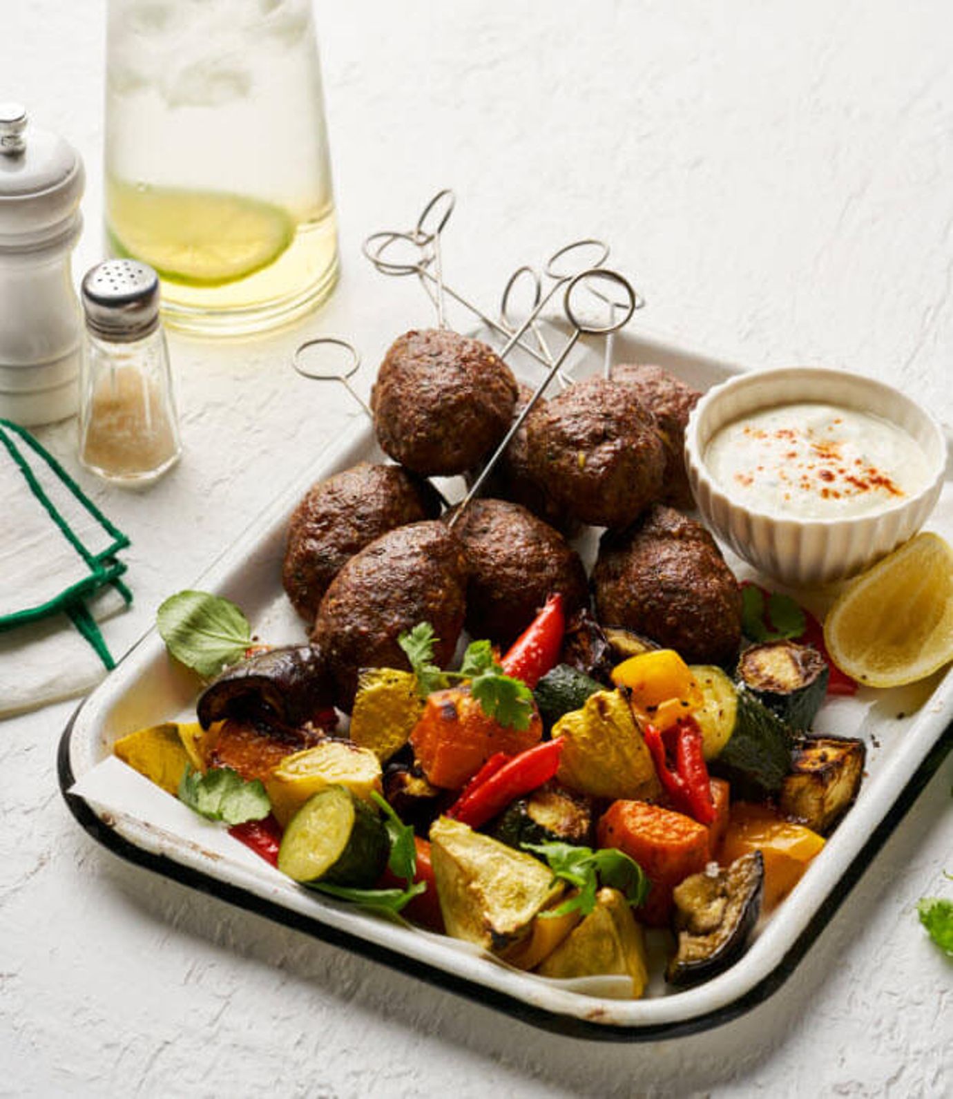 Cajun lamb koftas with roasted vegetable salad