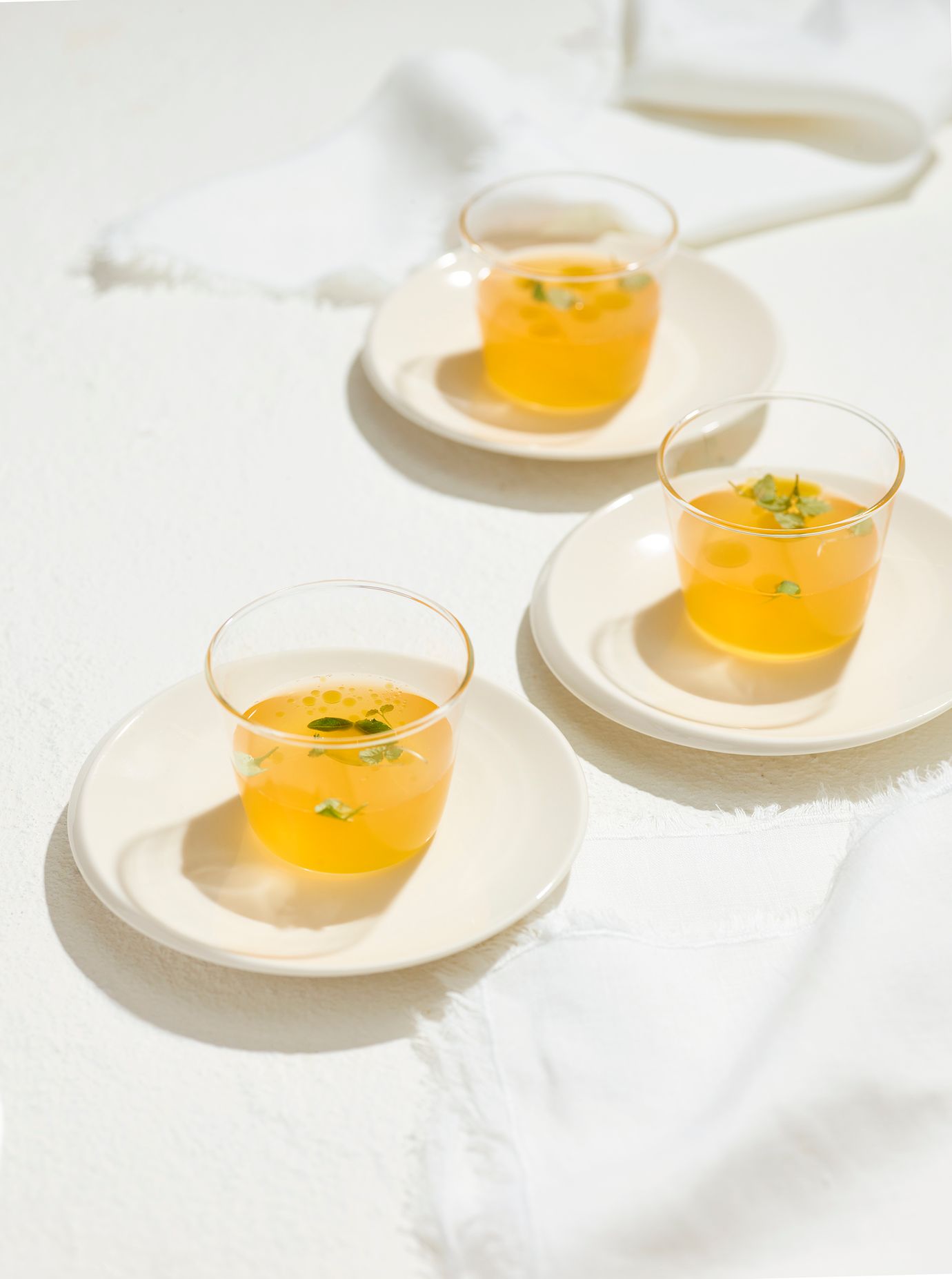 Tomato consommé with basil oil