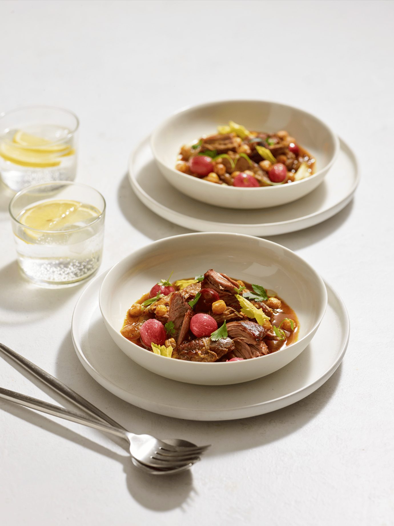 Lamb shoulder with Harira, slow roasted grapes and crispy chickpeas