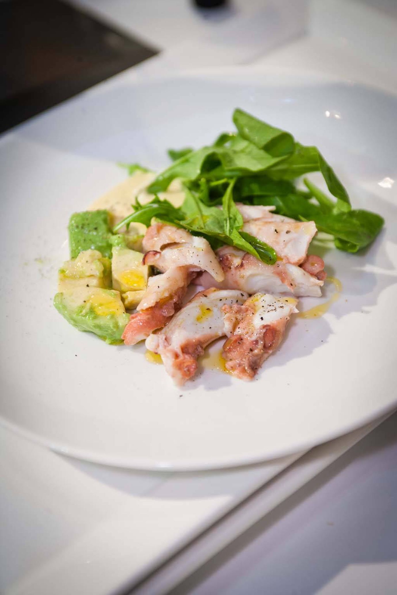 Octopus, avocado, orange and olive salad