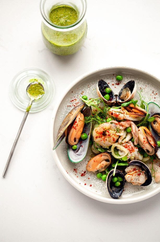 Chilled seafood salad with pickled shallots, peas, Aleppo chilli and mojo cilantro