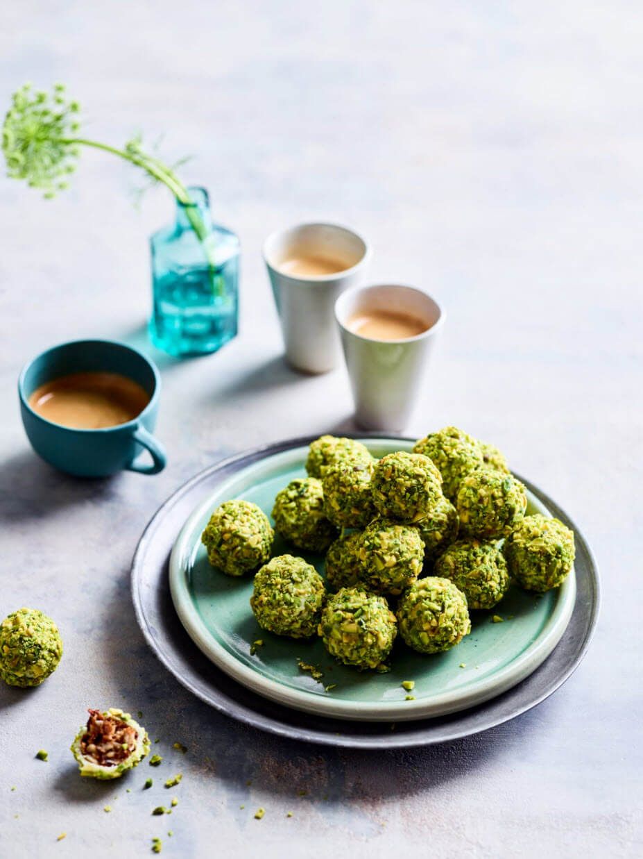 Plum pudding truffles dipped in chocolate and pistachios