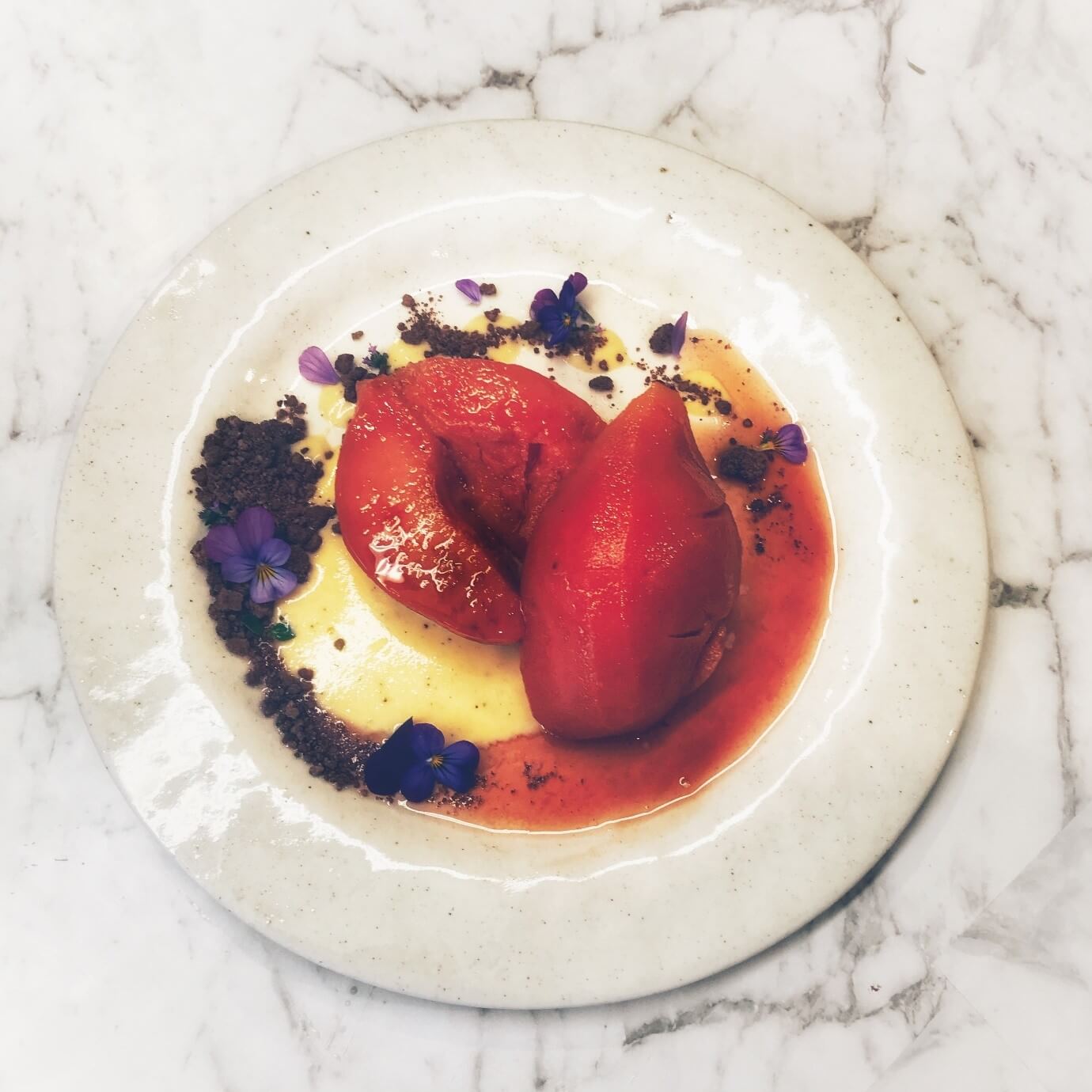 Poached quince with cinnamon anglaise and crystallised chocolate