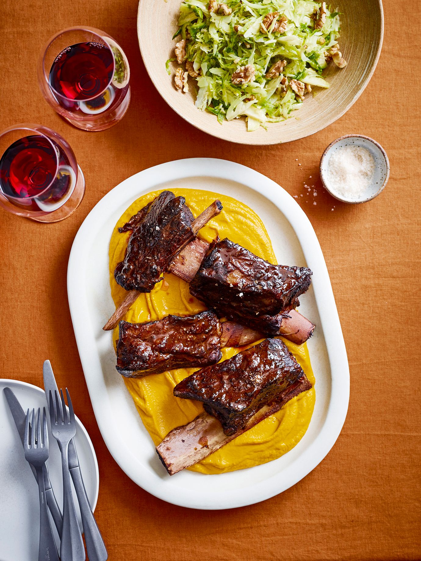 Braised short ribs with spiced carrot puree, brussels sprouts and walnut salad