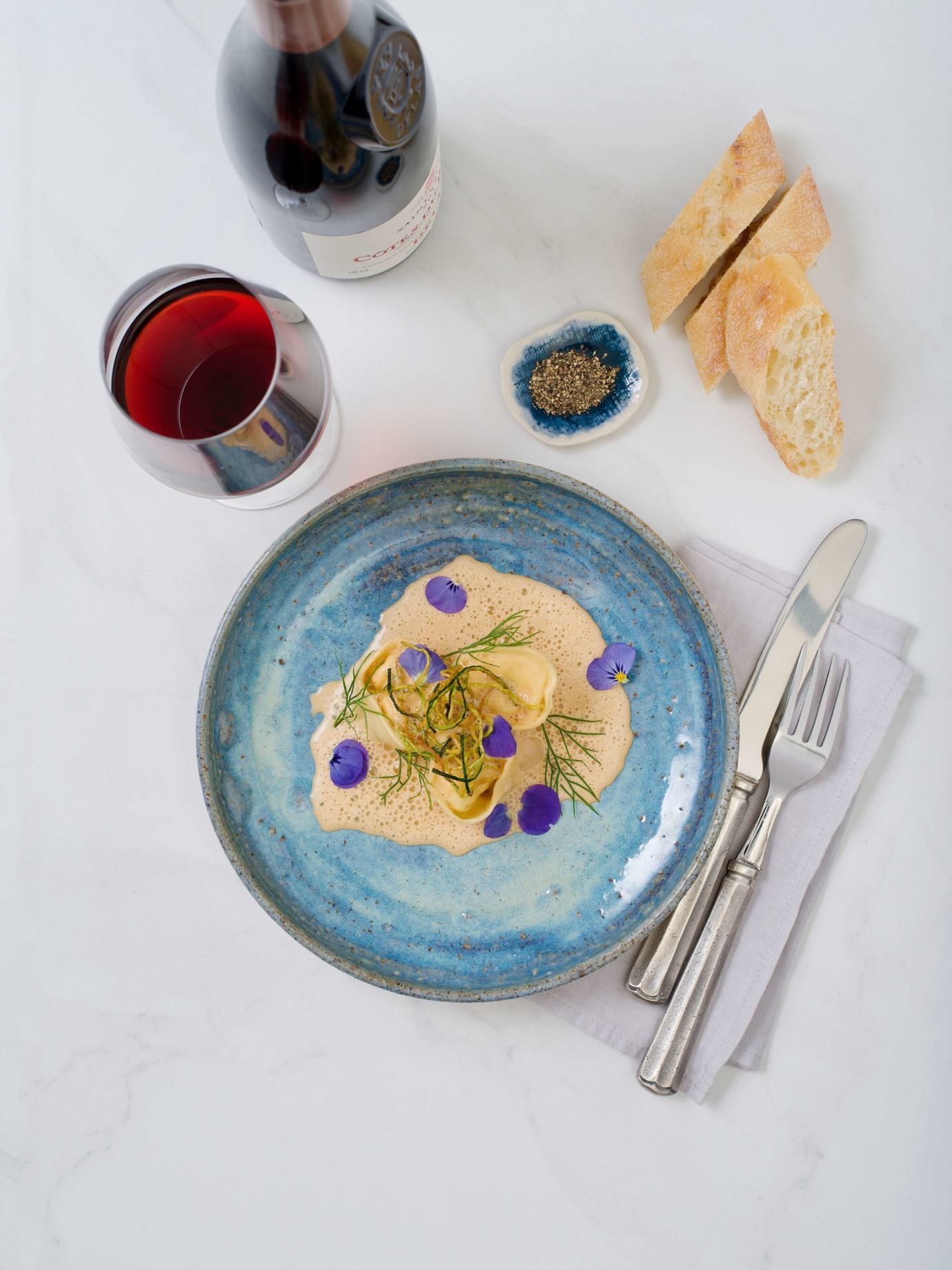 Handmade tortellini with crispy courgette and bisque sauce