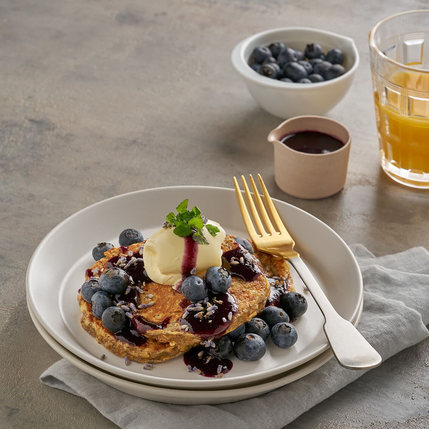 Oatmeal, chia and ricotta pancakes with blueberry and maple syrup