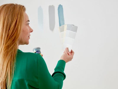 Woman looking at paint swatches