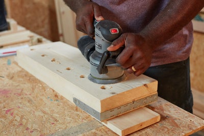 Sanding wood with electric sander