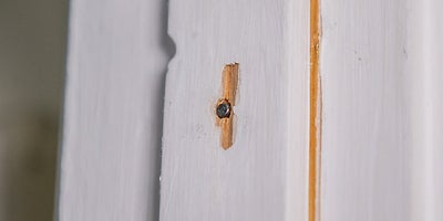 20.How-To-Fix-Door-Problems-Moving-Doorstop.jpeg
