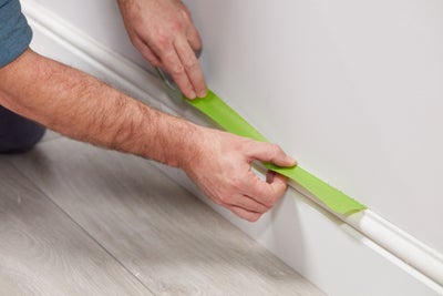 Protect skirting with masking tape