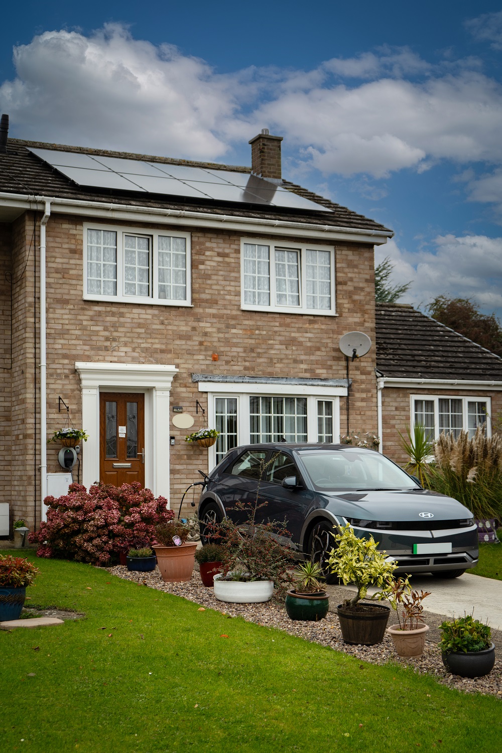 beige brick house solar panels.jpg