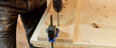 15._Drilling_holes_into_timberboard_through_jig_holes.jpg