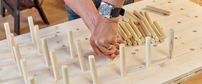 23._Fitting_dowel_cuts_into_pegboard_holes.jpg