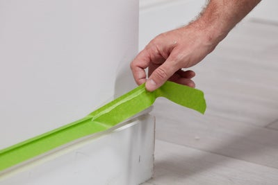 Protect the skirting with masking tape