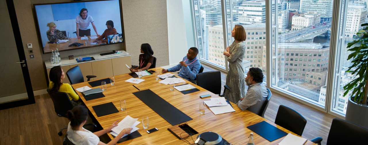 Business people video conferencing in a conference room meeting Business people video conferencing in a conference room meeting