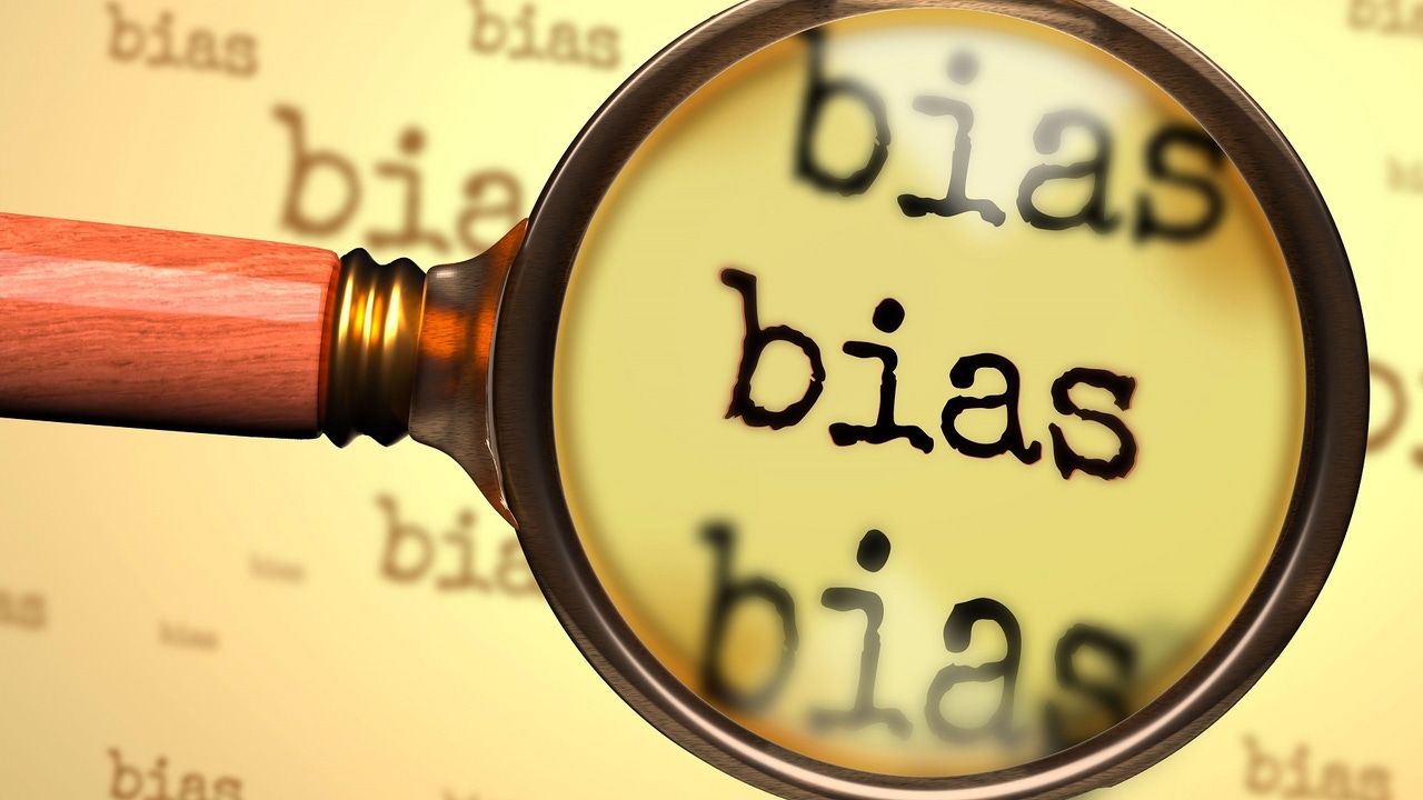 magnifying glass hovering over the word "bias" magnifying glass hovering over the word "bias"