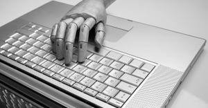 robot's hand pressing keyboard keys