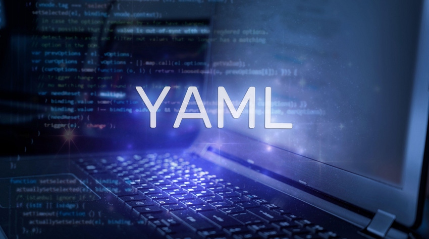 YAML inscription against a laptop and code background