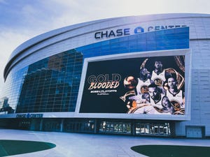 Exterior of Chase Center with Golden State Warriors poster