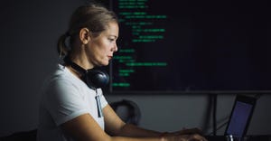 IT professional working on laptop IT professional working on laptop