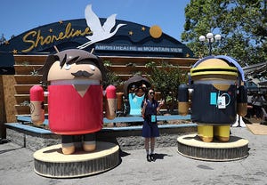Two riffs on the Android robot mascot flank the entrance to the Shoreline Ampitheatre. Two riffs on the Android robot mascot flank the entrance to the Shoreline Ampitheatre.