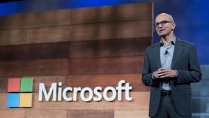 Nadella with Microsoft Logo