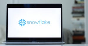 The logo of Snowflake displayed on a laptop screen
