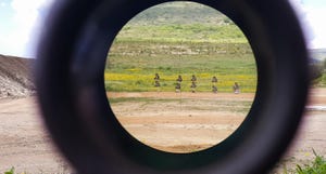 A look through an optical sight aimed at a group of potential targets at the range A look through an optical sight aimed at a group of potential targets at the range