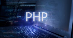 PHP inscription against laptop and code background